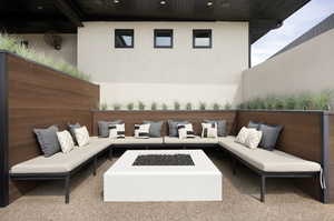View of patio featuring an outdoor living space with a fire pit