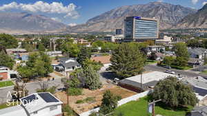 Aerial perspective of suburban area with a mountainous background