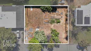 Aerial view of property and surrounding area featuring property parcel outlined