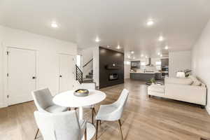 Dining space featuring stairway, light wood-style flooring, and recessed lighting