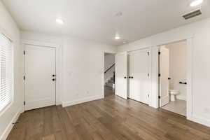 Interior space featuring light wood finished floors, recessed lighting, and connected bathroom