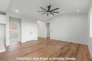 Unfurnished bedroom with lofted ceiling, recessed lighting, light wood-style floors, ceiling fan, and a closet