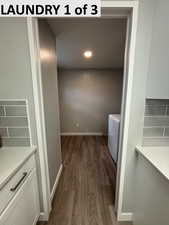 Laundry room with LVP flooring and washer/clothes dryer