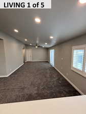 Livingroom featuring dark carpet, recessed lighting, and a ceiling fan