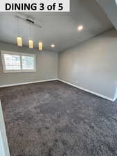 Dining with dark carpet, recessed & track lighting