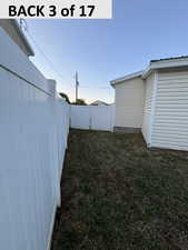 View of yard with a gate