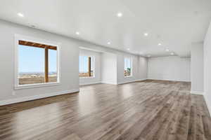 Unfurnished living room featuring recessed lighting and light wood-style floors