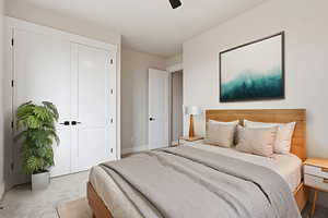 VIRTUALLY STAGED_Bedroom featuring carpet, a closet, and ceiling fan