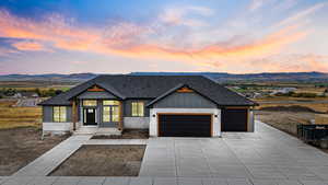 Modern inspired farmhouse with roof with shingles, a mountain view, a garage, and board and batten siding