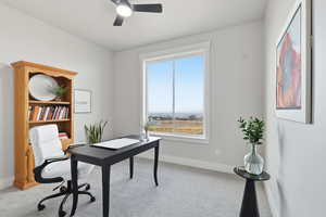 STAGED - Office space featuring light colored carpet and ceiling fan - BEDROOM