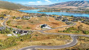 Aerial perspective of suburban area featuring a water and mountain view