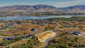 Aerial overview of property's location featuring a water and mountain view