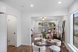 Dining space with recessed lighting and dark wood-type flooring
