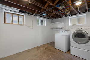 Laundry area with washing machine and clothes dryer