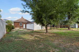 View of yard featuring a patio area and an outdoor structure