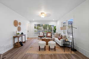 Sitting room featuring wood finished floors and baseboards