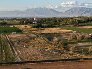 View of mountain backdrop featuring rural landscape and extensive farmland