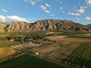 View of mountain backdrop with extensive farmland and rural landscape