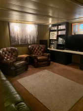 Living room featuring carpet and an office area