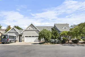 View of front of house with driveway and an attached garage