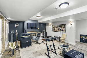 Playroom featuring light wood-type flooring and baseboards