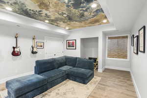 Living area featuring light wood-type flooring and recessed lighting