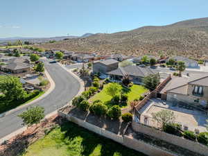 Aerial view of residential area featuring a mountainous background