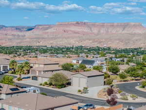 View of mountain background featuring nearby suburban area