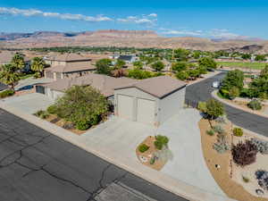 Aerial perspective of suburban area with a mountainous background