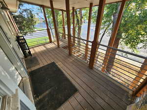 Wooden deck featuring a water view