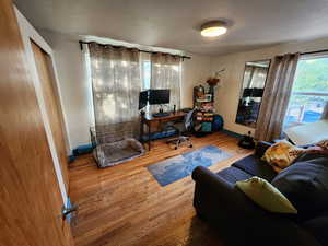 Office with wood finished floors and baseboards