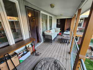 Wooden terrace with an outdoor living space