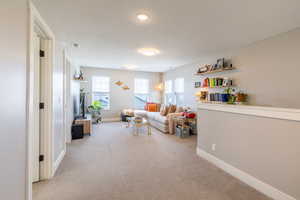 Living room with carpet flooring and baseboards
