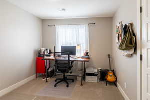 Office featuring carpet and baseboards