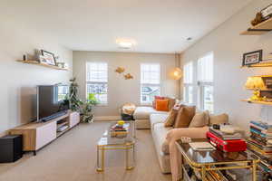Living room with carpet and baseboards