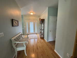 Foyer entrance featuring wood finished floors and a textured ceiling
