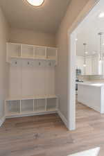Mudroom with light wood-style floors and recessed lighting