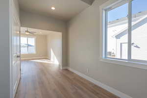 Spare room featuring light wood-style floors, recessed lighting, and a ceiling fan