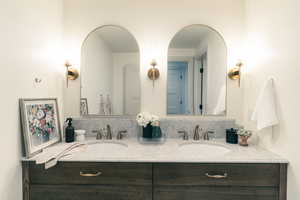 Full bathroom featuring double vanity