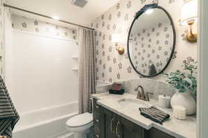 Full bath with shower / tub combo and vanity