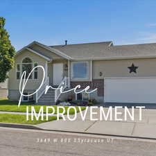 View of front of property featuring brick siding, a garage, roof with shingles, a front lawn, and driveway
