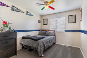 Bedroom with carpet flooring and a ceiling fan