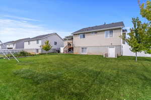 Rear view of property featuring stairs