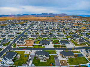 Aerial perspective of suburban area featuring a mountainous background