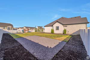 Fenced backyard featuring a playground and a residential view