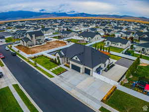 Aerial view of residential area featuring a mountain backdrop