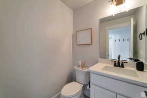 Bathroom featuring vanity and toilet