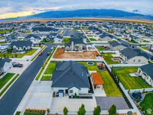 Aerial perspective of suburban area featuring a mountain backdrop