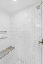 Bathroom featuring tiled shower