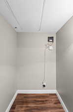 Laundry room with dark wood-style flooring